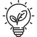 Eine Glüh-Lampe mit grünen Blättern. Eine Glüh-Lampe mit grünen Blättern.